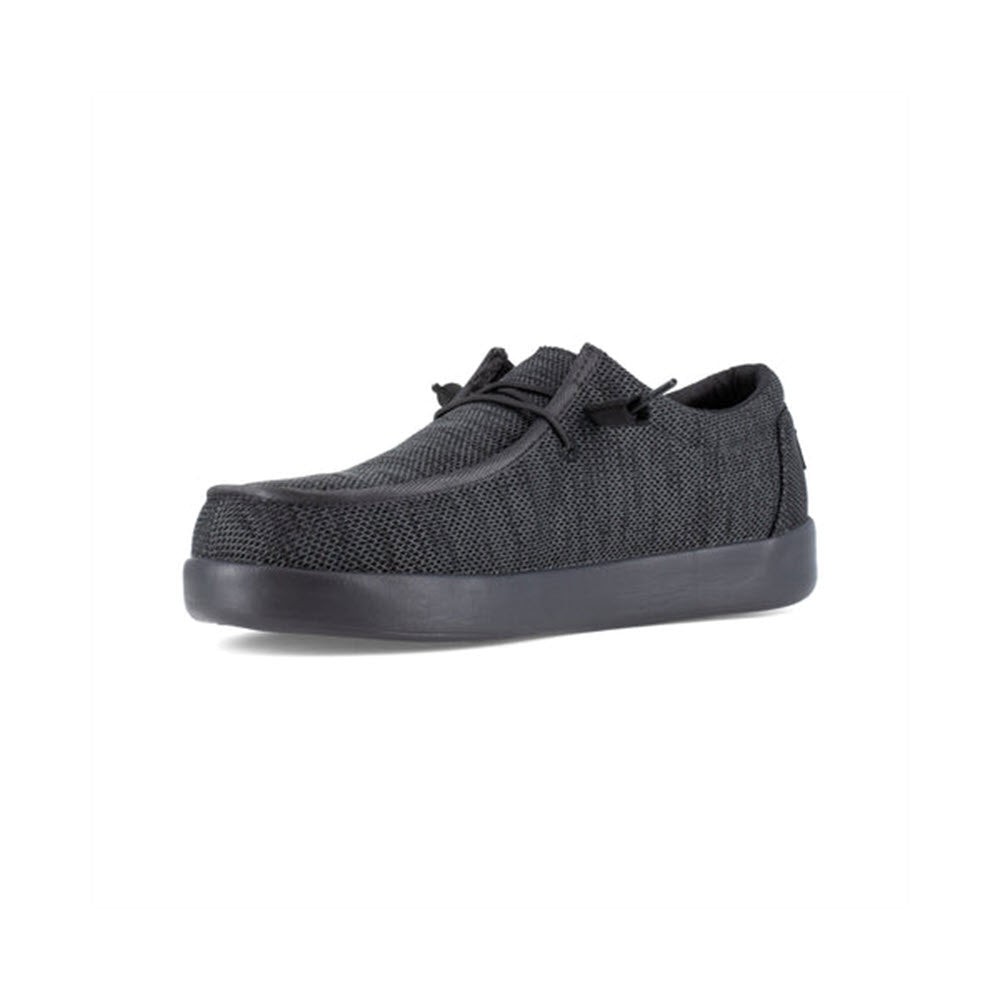 Volcom VOLCOM CHILL COMPOSITE TOE SLIP ON WORK SHOE BLACK - WOMENS with a textured fabric upper and slip-resistant rubber sole, viewed from a side angle against a white background.