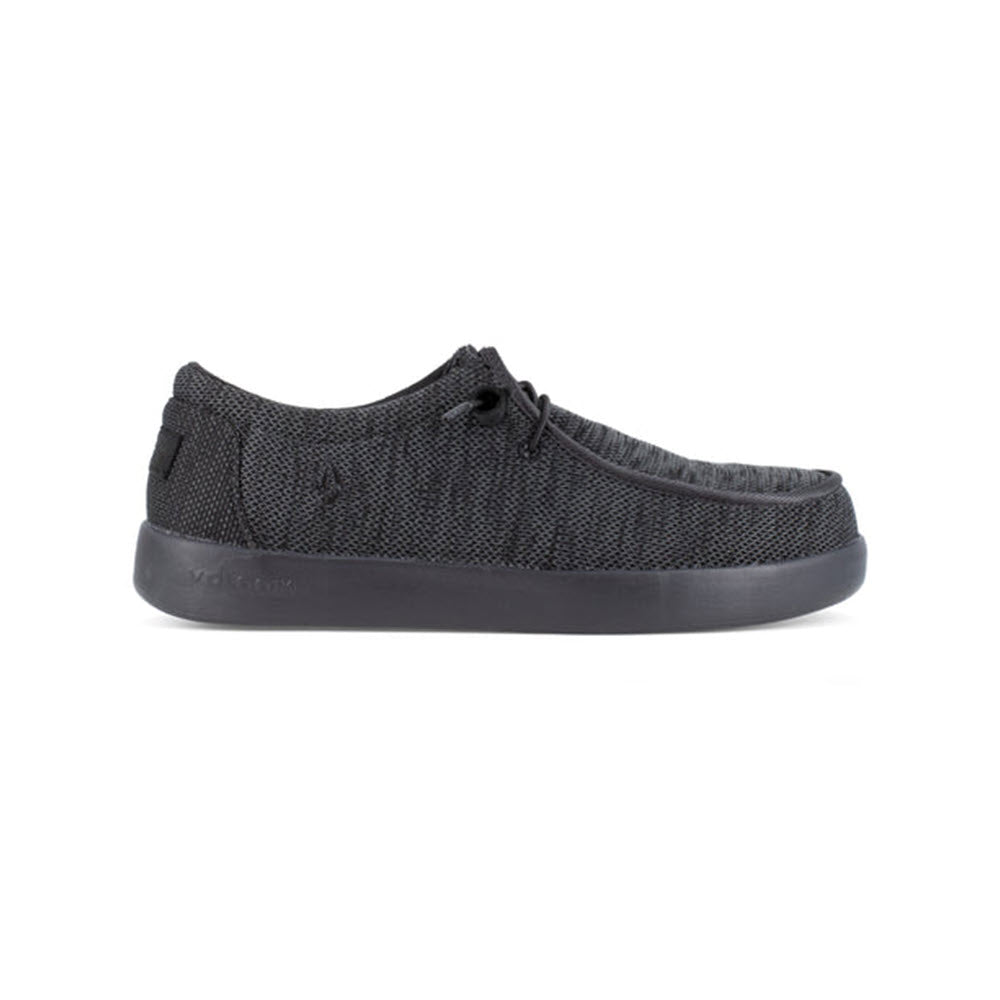 A single black VOLCOM CHILL COMPOSITE TOE SLIP ON WORK SHOE BLACK - WOMENS with a rubber sole and laces, viewed from the side, featuring slip-resistant outsoles for enhanced safety by Volcom.