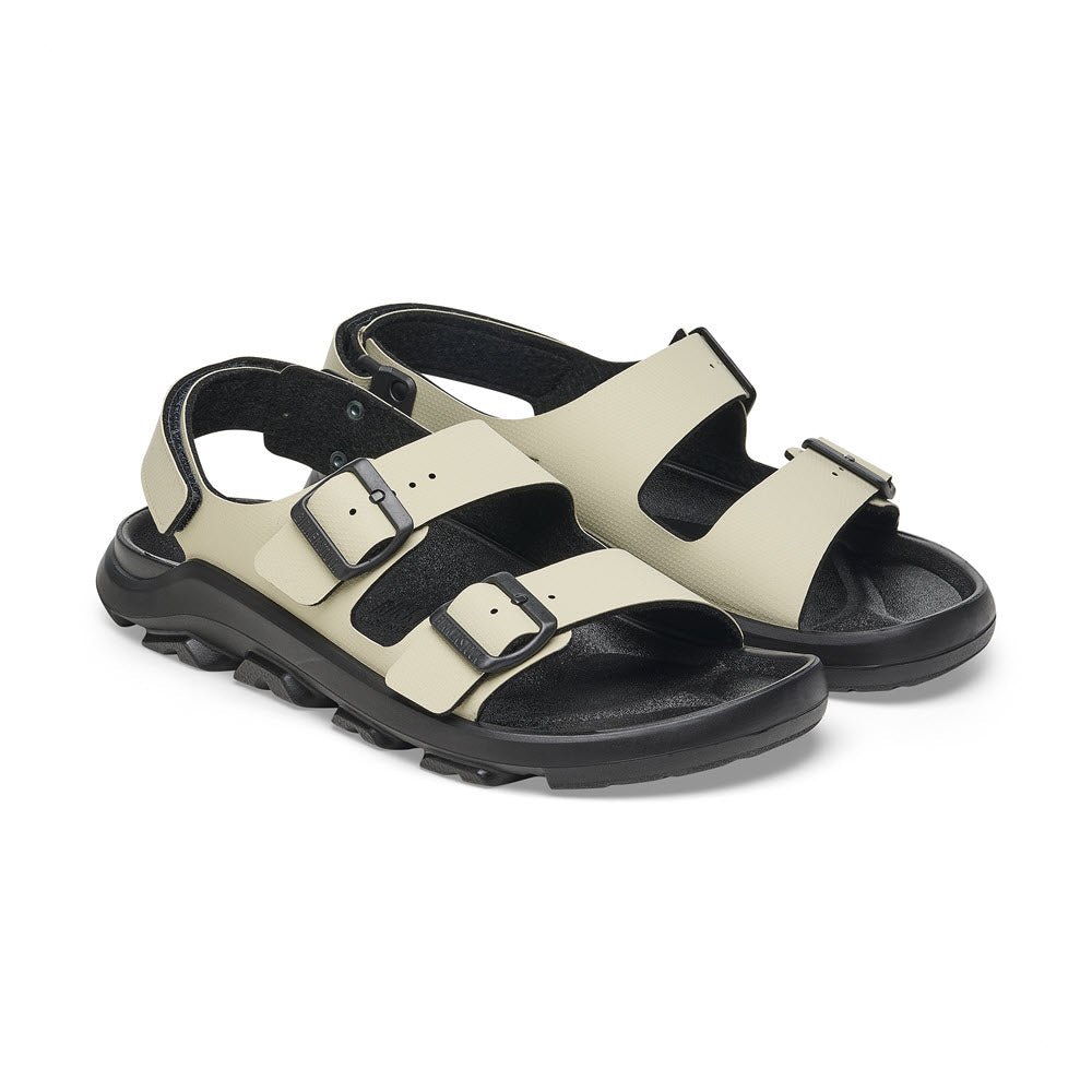 A pair of **BIRKENSTOCK MOGAMI TERRA OASIS EUCALYPTUS - WOMENS** sandals with two adjustable straps and a rugged sole, featuring a waterproof footbed for durability.