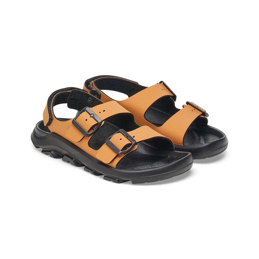 A pair of BIRKENSTOCK MOGAMI TERRA OASIS BURNT ORANGE - WOMENS sandals with a rugged PU sole, thick soles, and adjustable straps from Birkenstock.