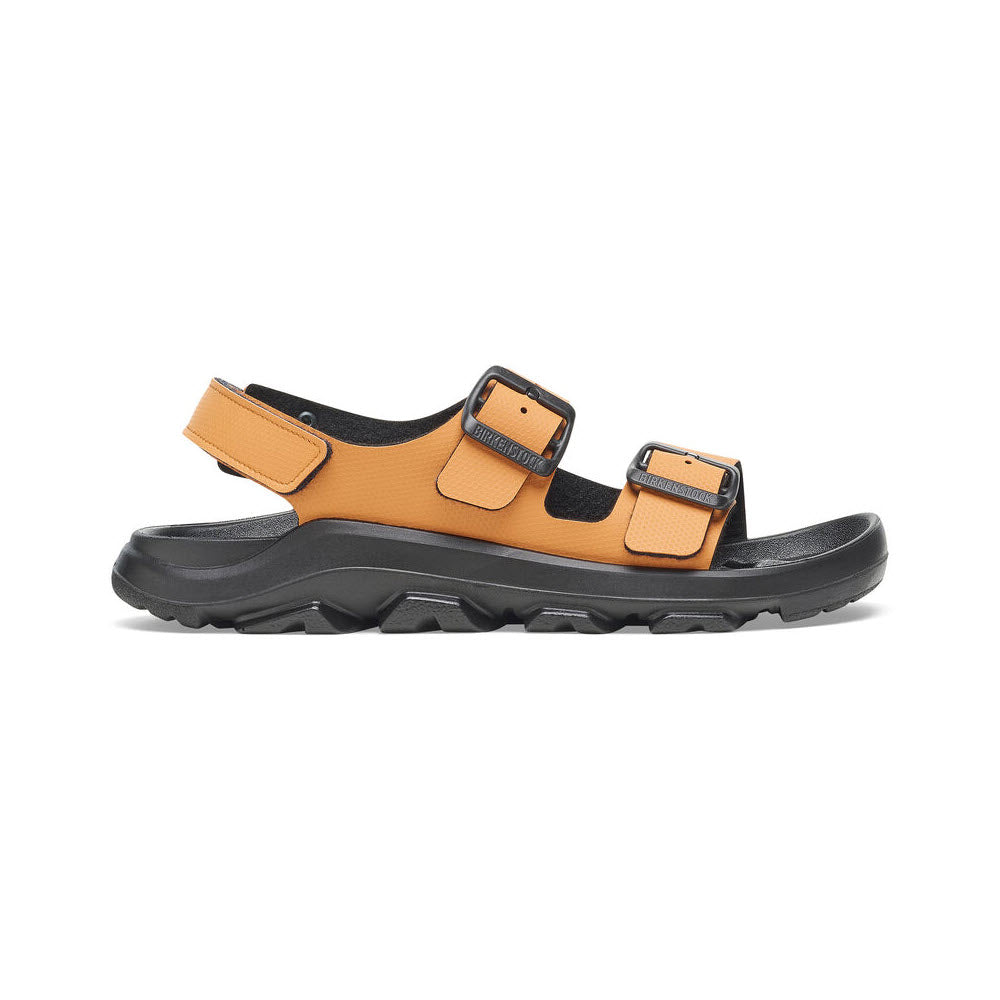 A side view of a BIRKENSTOCK MOGAMI TERRA OASIS BURNT ORANGE - WOMENS with black soles and two adjustable straps featuring black buckles, designed with a rugged PU sole for all-terrain grip.