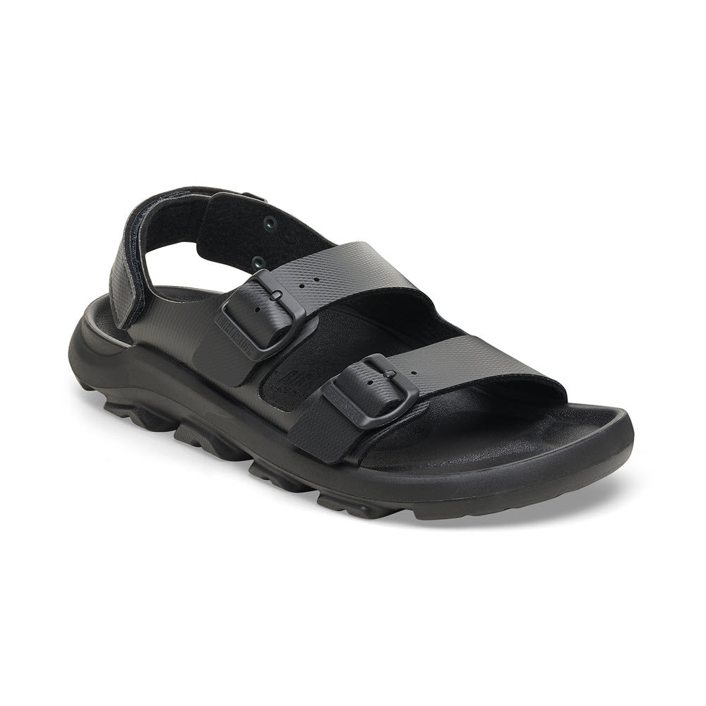 The BIRKENSTOCK MOGAMI TERRA OASIS BLACK - WOMENS is a black sandal with two adjustable straps, each featuring a buckle. It boasts a thick sole, ankle support, and a waterproof footbed, making it the perfect durable sandal for any adventure.