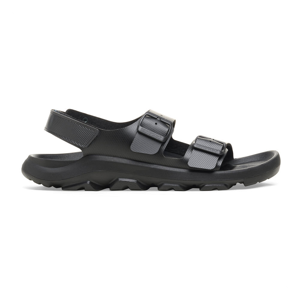 Side view of a black Birkenstock BIRKENSTOCK MOGAMI TERRA OASIS BLACK - WOMENS with two adjustable straps and a rugged, durable sole.