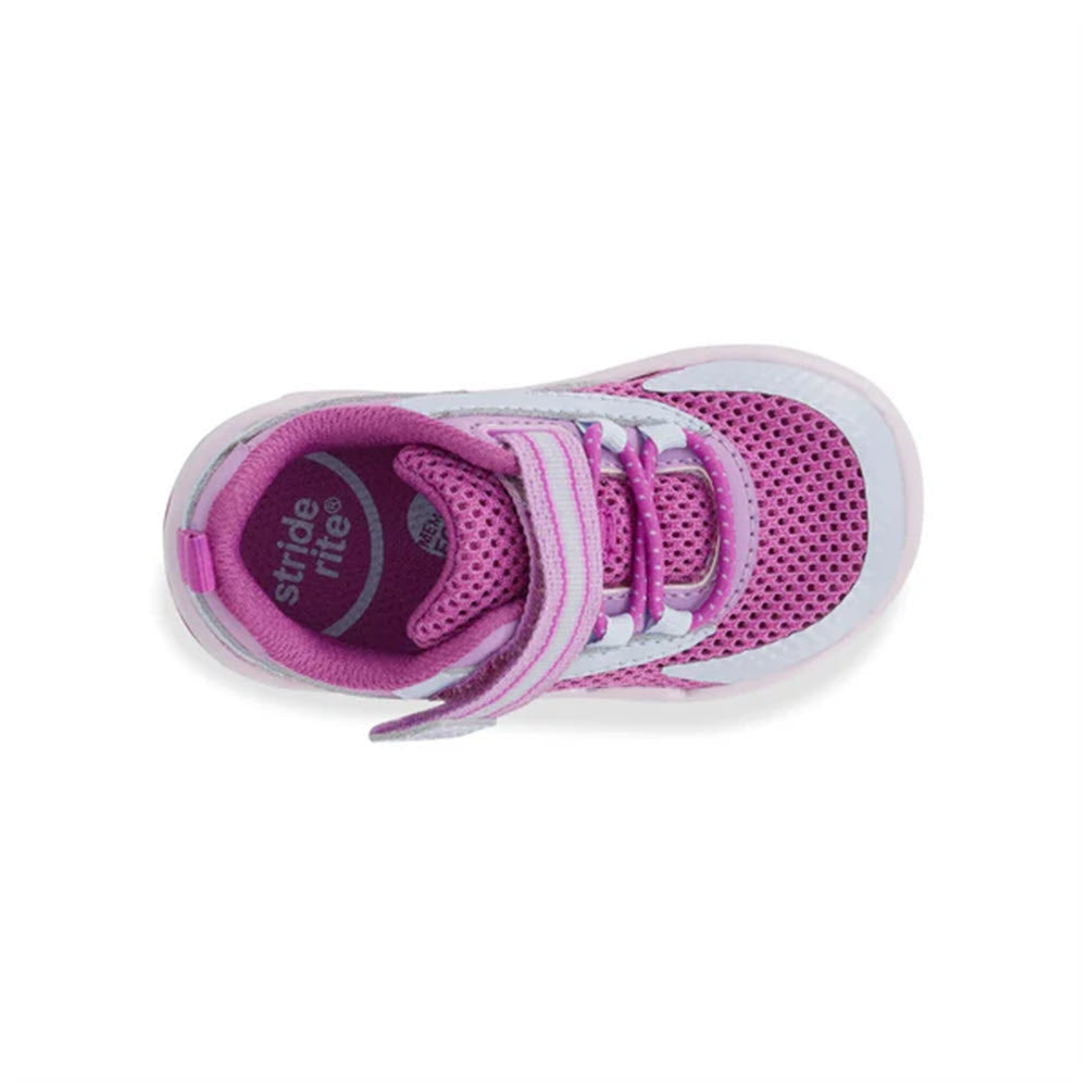 A single purple toddler shoe on a white background, showcasing the brand name &quot;Stride Rite&quot; inside. This STRIDE RITE SRT IAN PURPLE - KIDS sneaker features a Velcro strap and a comfortable memory foam footbed, making it one of the most sporty shoes for little feet.