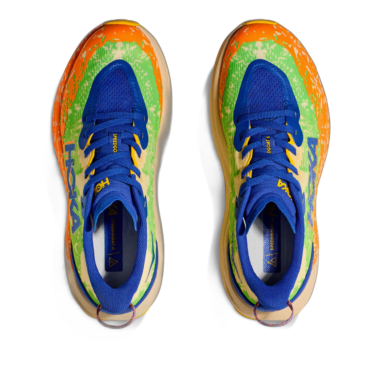 Presenting the HOKA SPEEDGOAT 6 YOUTH ULTRAMARINE - KIDS, a colorful pair of running shoes designed for kids. These shoes feature a lightweight woven blue upper, with vibrant green and yellow sides, and striking orange accents. The laces are blue, complemented by a beige sole. The renowned Hoka brand name is prominently displayed on both the side and tongue of the shoe. An internal support chassis ensures optimal stability during wear.