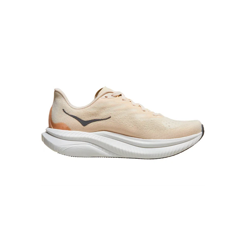 The HOKA MACH 6 EGGNOG/VANILLA - WOMEN&#39;S running shoe from Hoka features a beige design with a white sole and a subtle black swoosh on the side, making it perfect for daily training as a road running shoe.