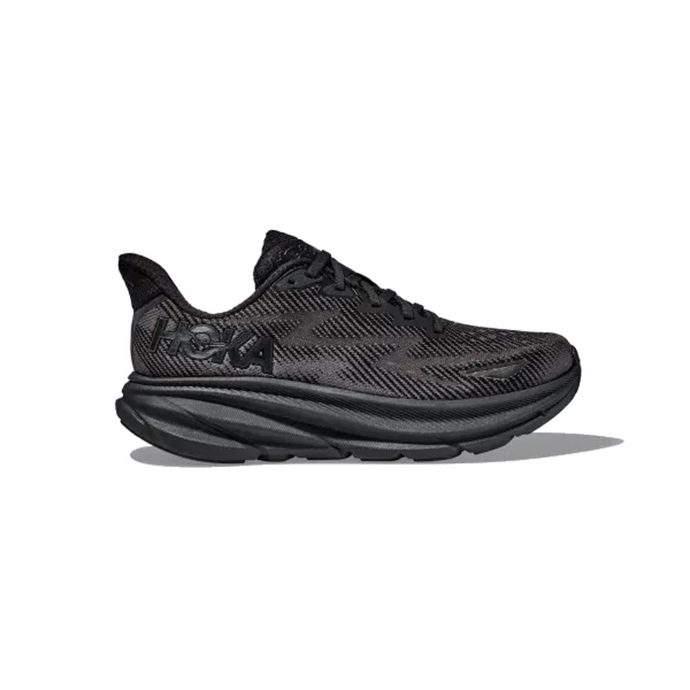 Crafted by Hoka, the HOKA CLIFTON 9 BLACK/BLACK - WOMENS athletic shoe features a breathable engineered mesh upper, a large cushioned sole, a cushioned tongue, and the brand&#39;s logo on the side.