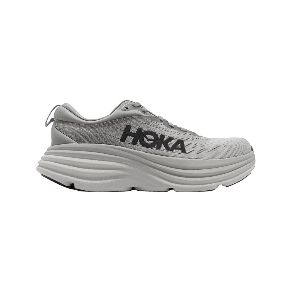 The Hoka Bondi 8 Sharkskin/Harbor Mist - Mens athletic shoe features a thick, cushioned sole with extended heel geometry, the &quot;HOKA Bondi&quot; logo on the side, and is made with softer, lighter foams.