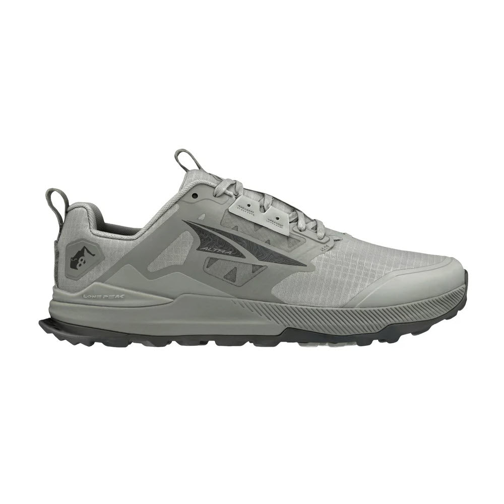 The ALTRA LONE PEAK 8 TAUPE - MENS by Altra is a gray athletic shoe featuring a low-top design, rugged MaxTrac™ outsole, and reinforced toe and heel areas, making it perfect for trail adventures.