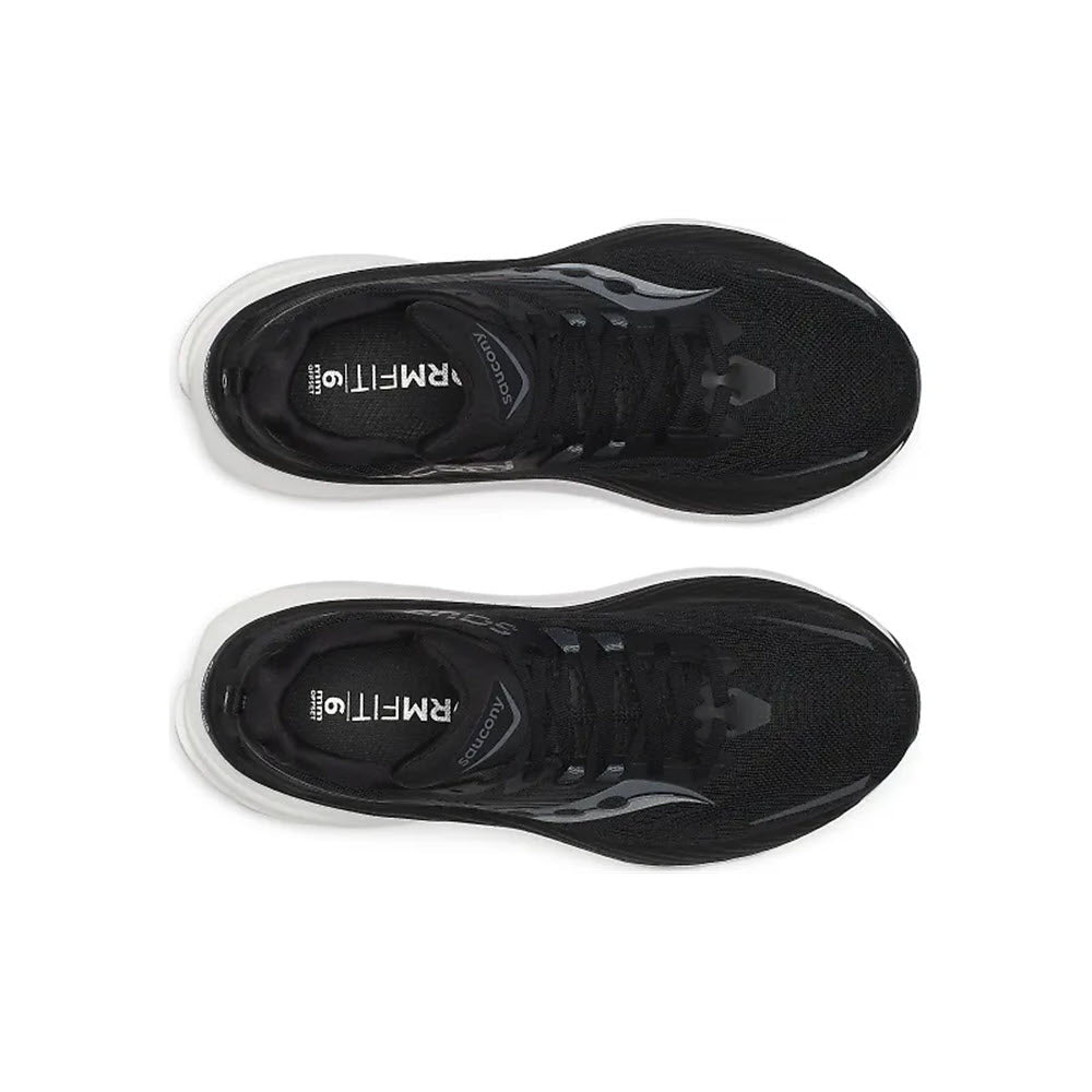 Top view of a pair of black stability shoes with white soles, laid side by side. The brand name &quot;Saucony&quot; and model &quot;Hurricane 24&quot; are visible on the insoles.