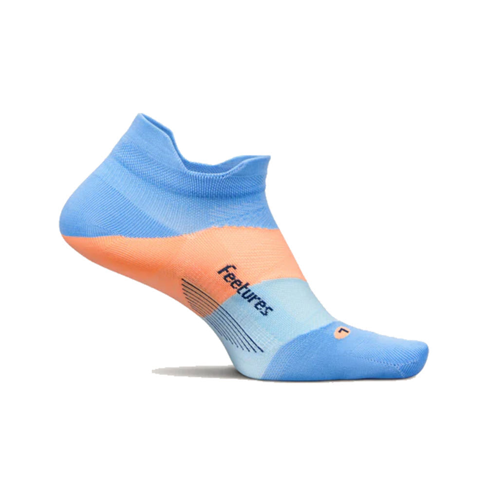 Introducing the Feetures Elite Ultra Light No Show Tab Socks in Blue Burst, a perfect blend of blue and orange. With &quot;Feetures&quot; proudly printed on the side, these low-cut socks are your ideal companion for any adventure. Presented against a plain white background.