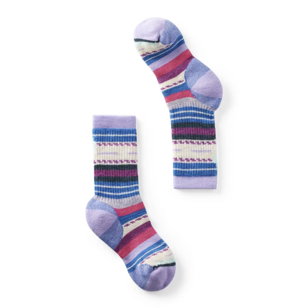 SMARTWOOL FULL CUSHION MARGARITA CREW SOCKS ULTRAVIOLET - KIDS by Smartwool are vibrant socks featuring a cheerful mix of horizontal and zigzag stripes in shades of purple, blue, red, and white. These colorful kids&#39; hiking socks are perfect for any adventurous hike.