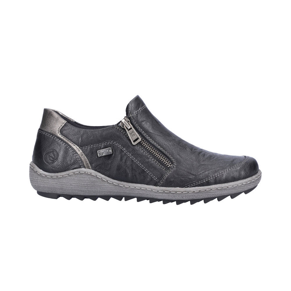 The REMONTE EURO CITY SLIP ON BLACK - WOMENS by Remonte is a black suede leather slip-on sneaker with grey accents, featuring a side zipper and a thick, rugged sole, making it ideal for business casual attire.
