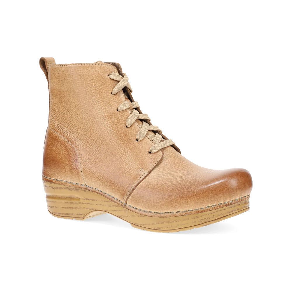 The Dansko Sigourney Honey Distressed for women is a tan leather cozy lace-up boot with beige laces and a wooden wedge heel.