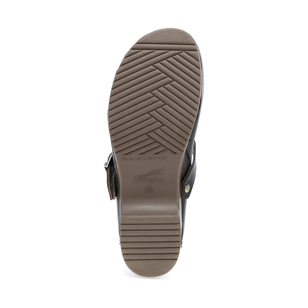 The image of the DANSKO BAYLOR BLACK - WOMENS backless clog from Dansko shows a grooved rubber sole with a herringbone pattern and a small raised logo.