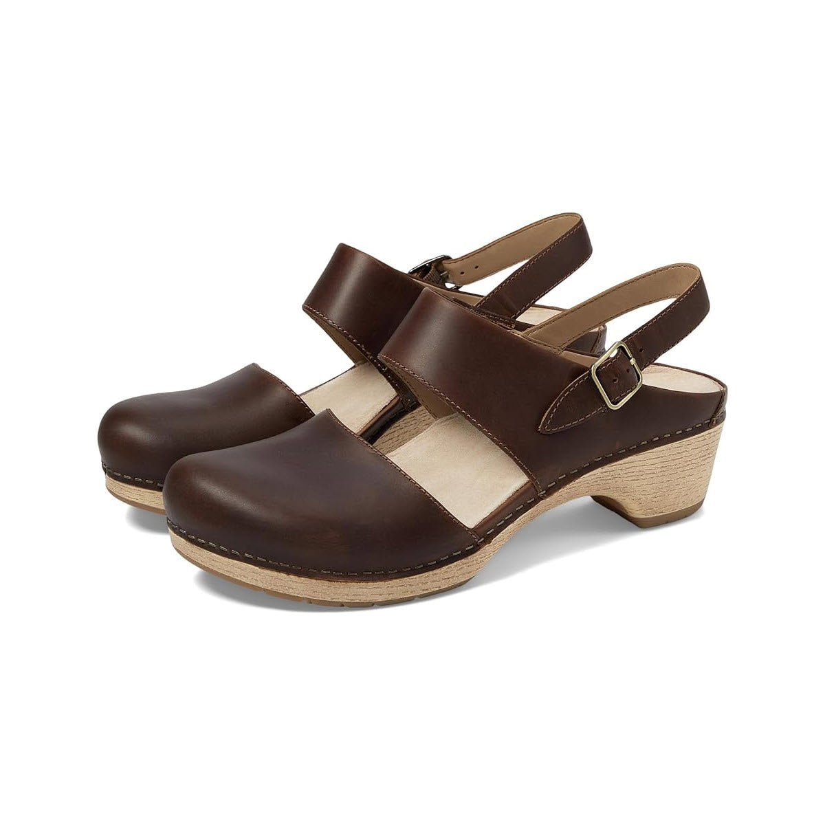 Introducing the Dansko Lucia Tan for women, a stylish pair of brown leather clogs featuring a buckled, adjustable heel strap and a wooden wedge heel.