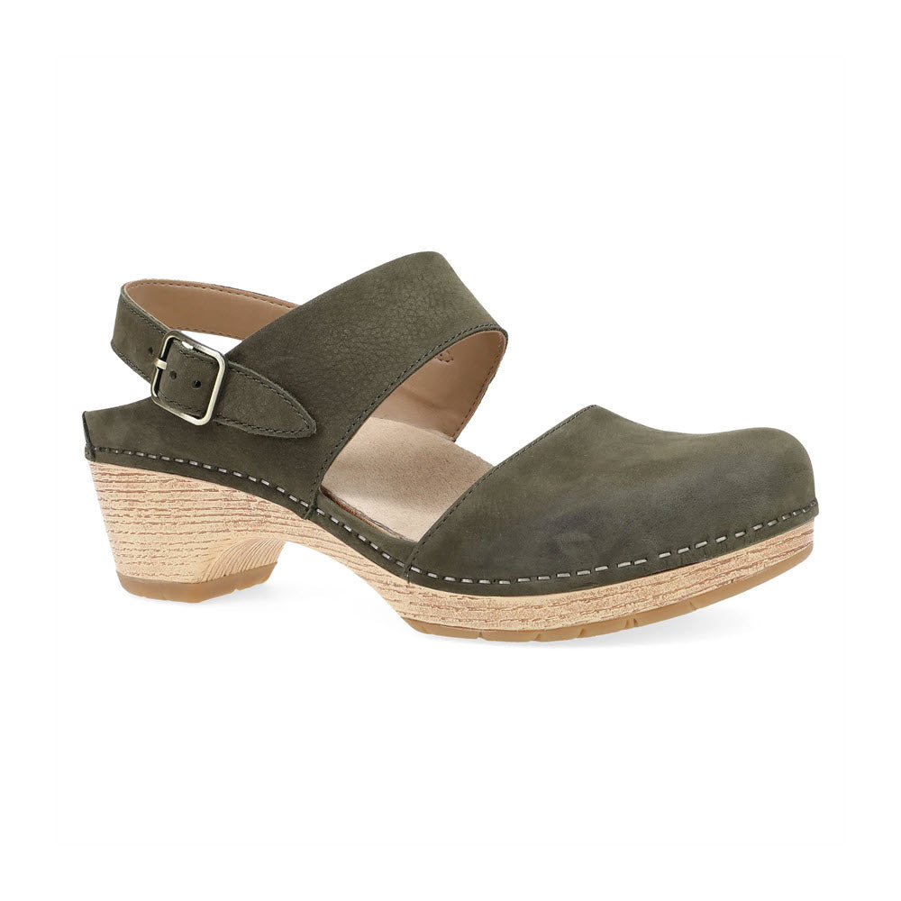 A DANSKO LUCIA IVY - WOMENS olive green suede closed-toe clog with a thick, slightly raised tan wooden heel, featuring an adjustable over-the-foot strap with a buckle and delicate stitching along the sole—perfect fall footwear from Dansko.