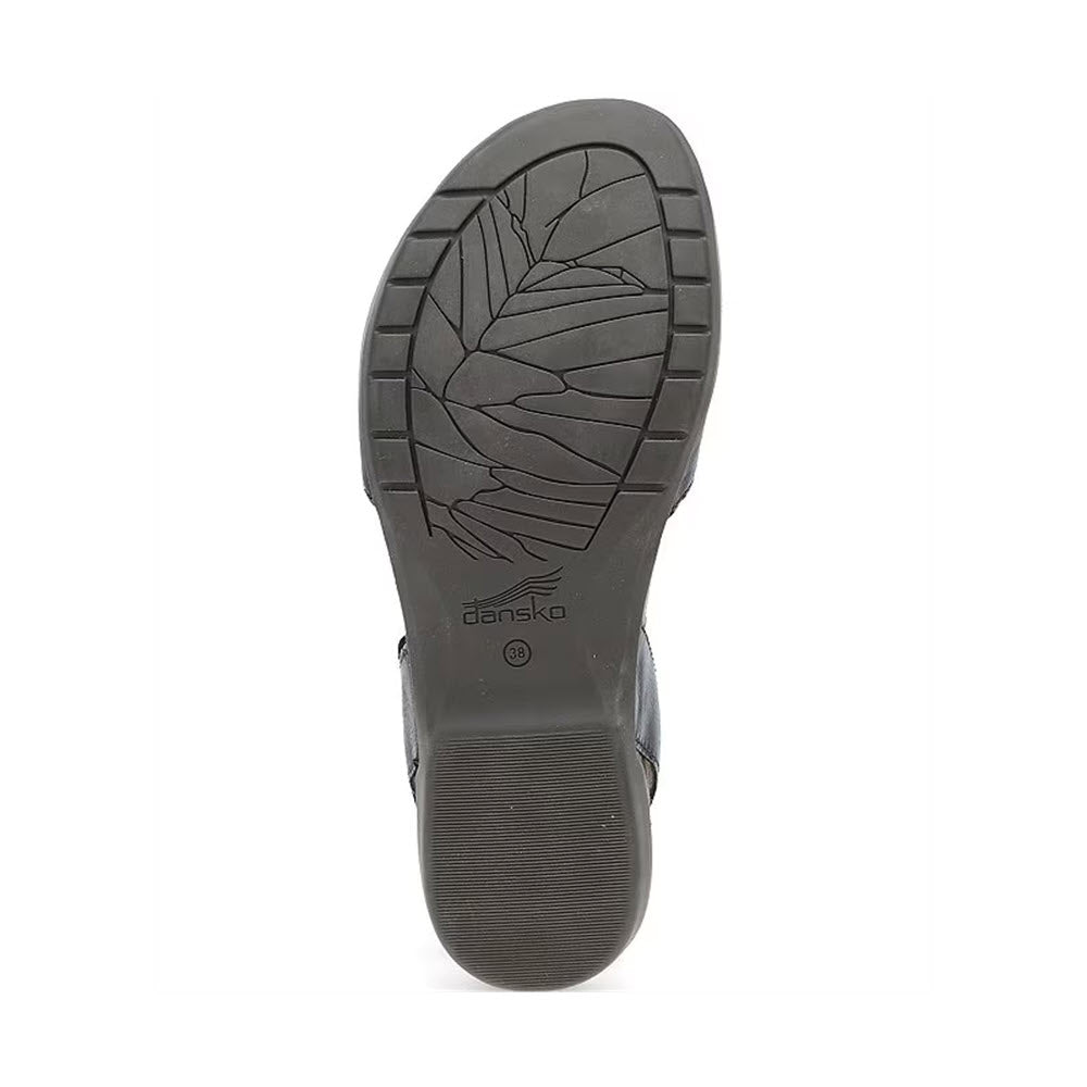 Bottom view of a black Dansko Rowan Black Leather - Womens shoe sole, featuring a leaf-pattern tread and the Dansko logo in the middle. The perfect complement to their memory foam footbed for unparalleled comfort.