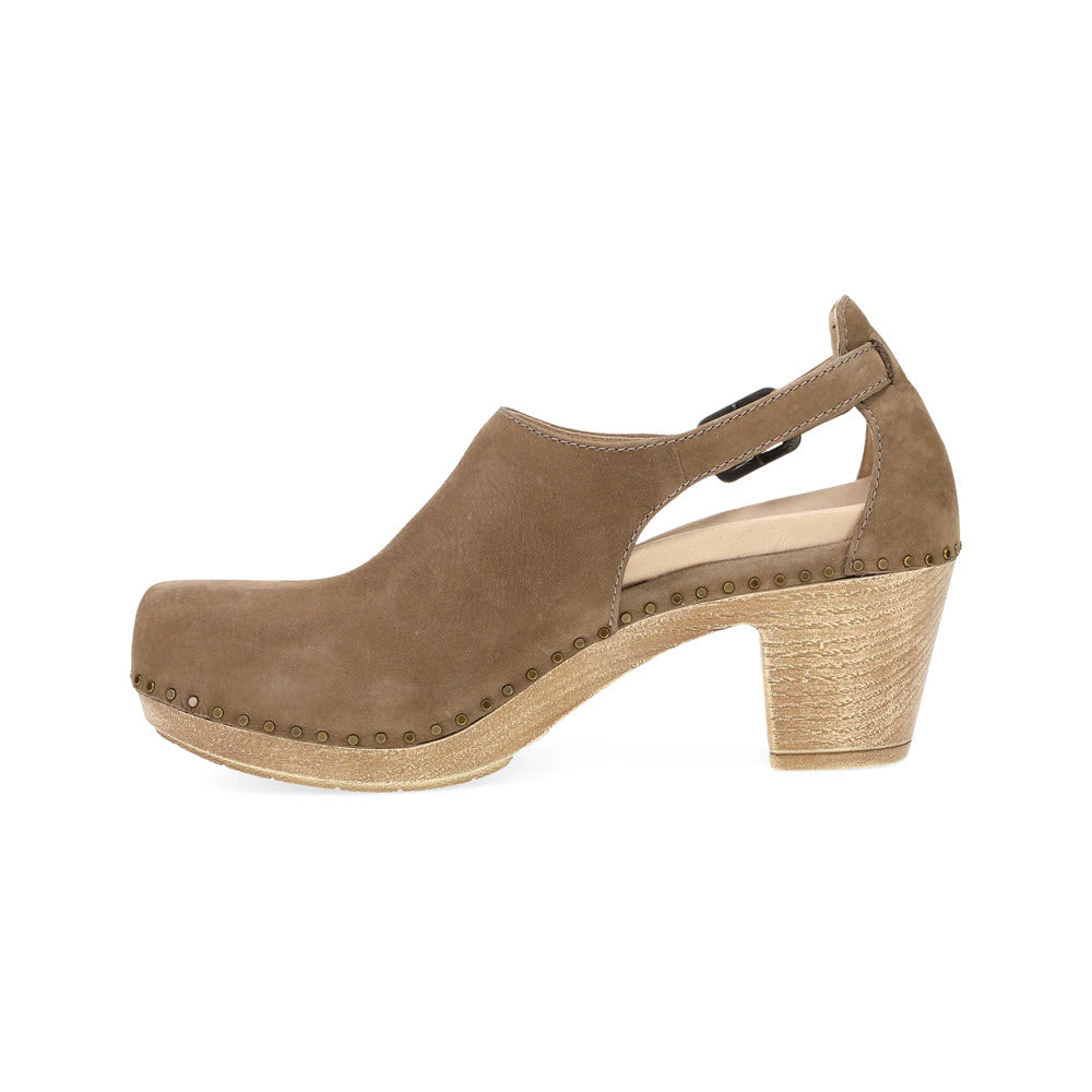 Introducing the Dansko Sassy Morel for women—a tan suede clog with a chunky, transitional heel, featuring an open back and stud detailing along the sole and heel, designed by Dansko.