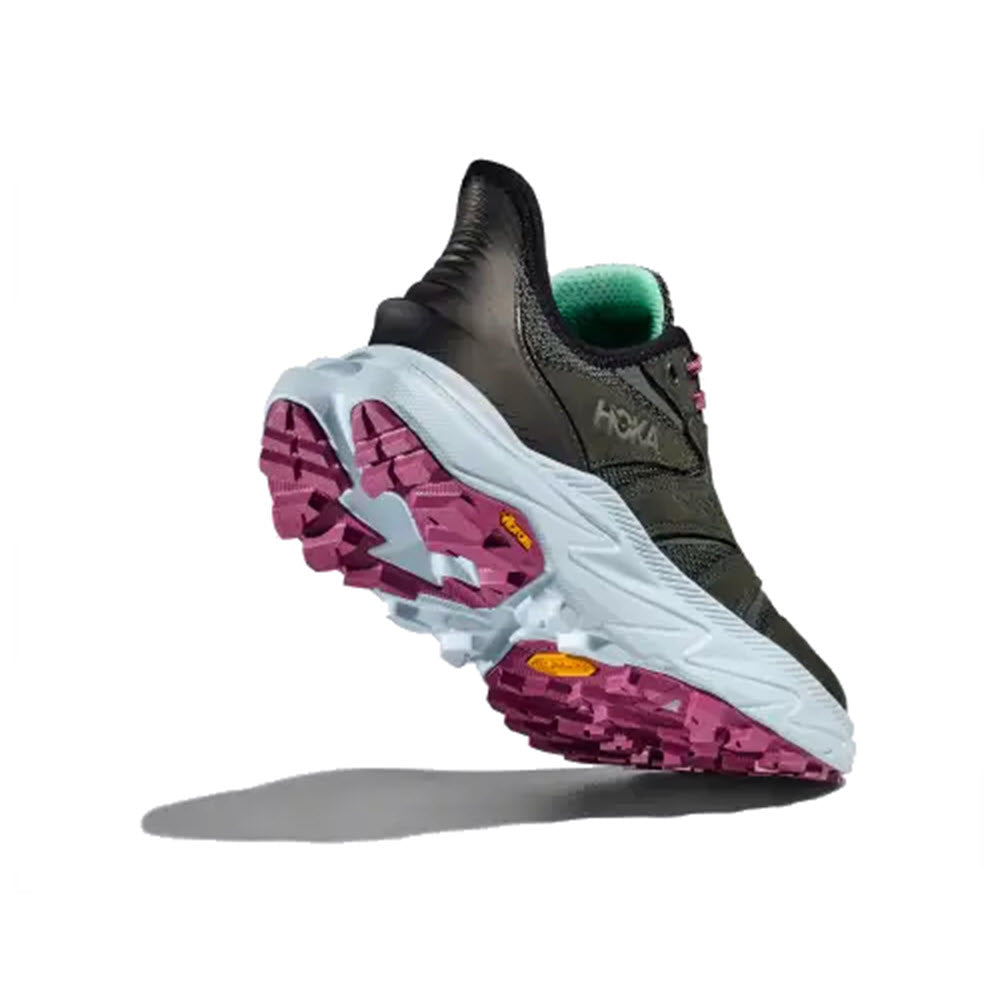 HOKA ANACAPA 2 FREEDOM OUTER ORBIT/OVERCAST - WOMENS athletic shoe by Hoka, featuring a black and green design with a thick, white and purple sole, shown from a rear angled view. Ultra-ventilated upper made from 100% rPET for maximum breathability.