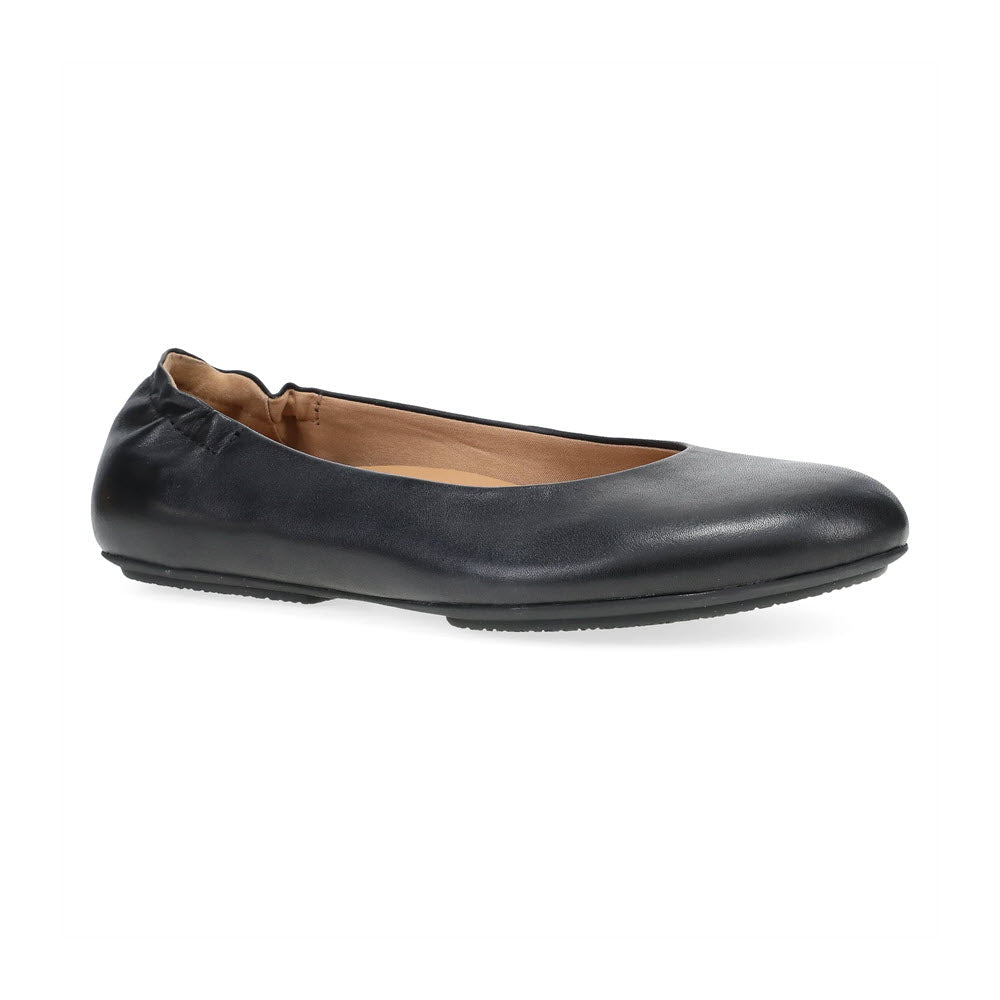 A chic black ballet flat from Dansko, named the DANSKO MOLLIE BLACK - WOMENS, features a slightly elasticated opening and a plain design that epitomizes Dansko&#39;s commitment to comfort. The shoe is shown from a three-quarter angle against a white background.