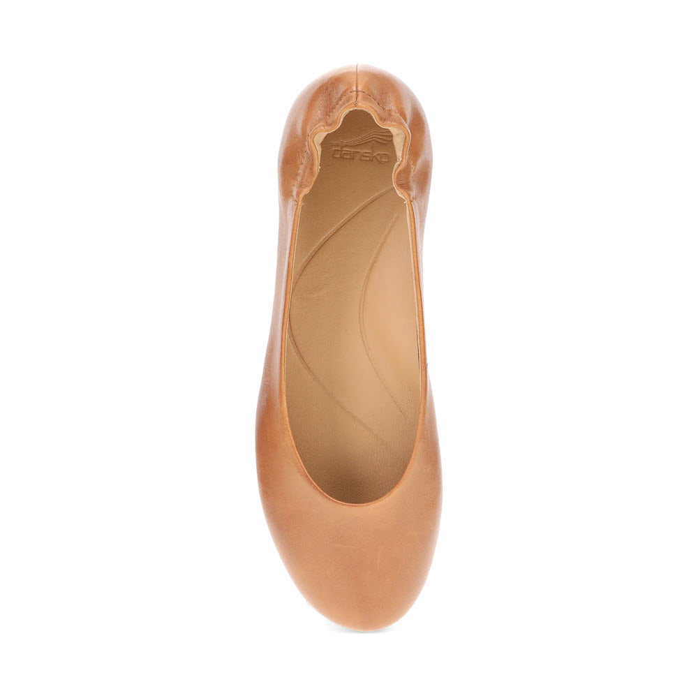 Top view of a single tan DANSKO MOLLIE LUGGAGE - WOMENS ballet flat shoe featuring a round toe and a slightly gathered, elasticized edge for chic comfort by Dansko.