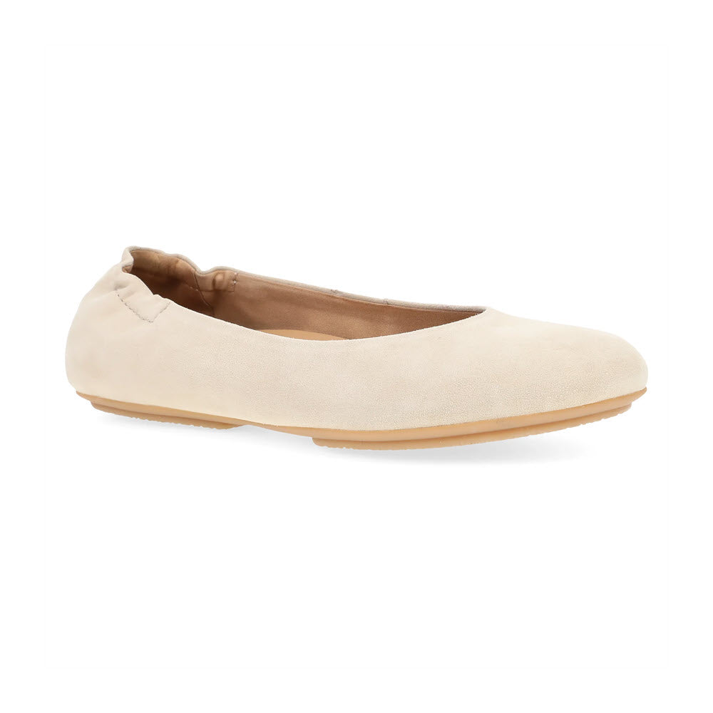 The Dansko Mollie Sand - Womens offers chic comfort with its beige hue, rubber sole, and slightly cushioned insole.