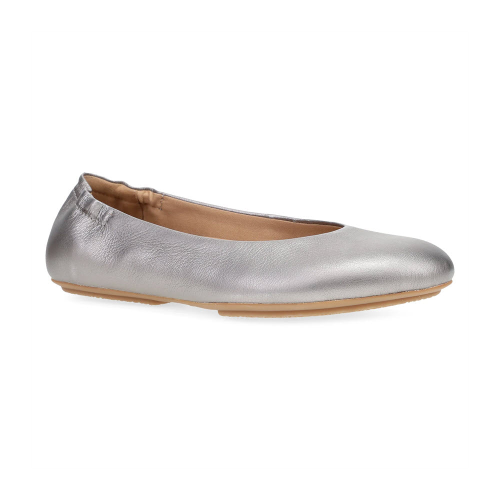 A single DANSKO MOLLIE PEWTER - WOMENS by Dansko in chic comfort style, featuring a silver rounded toe and a tan sole, positioned against a plain white background.