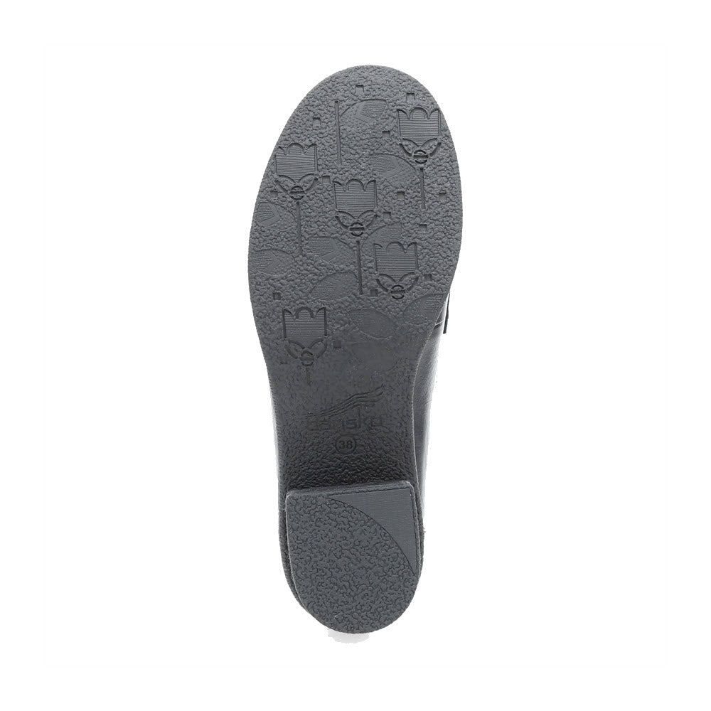 The bottom of a Dansko Danica Black women&#39;s loafer showing the sole with a pattern of tulips and diagonal lines.