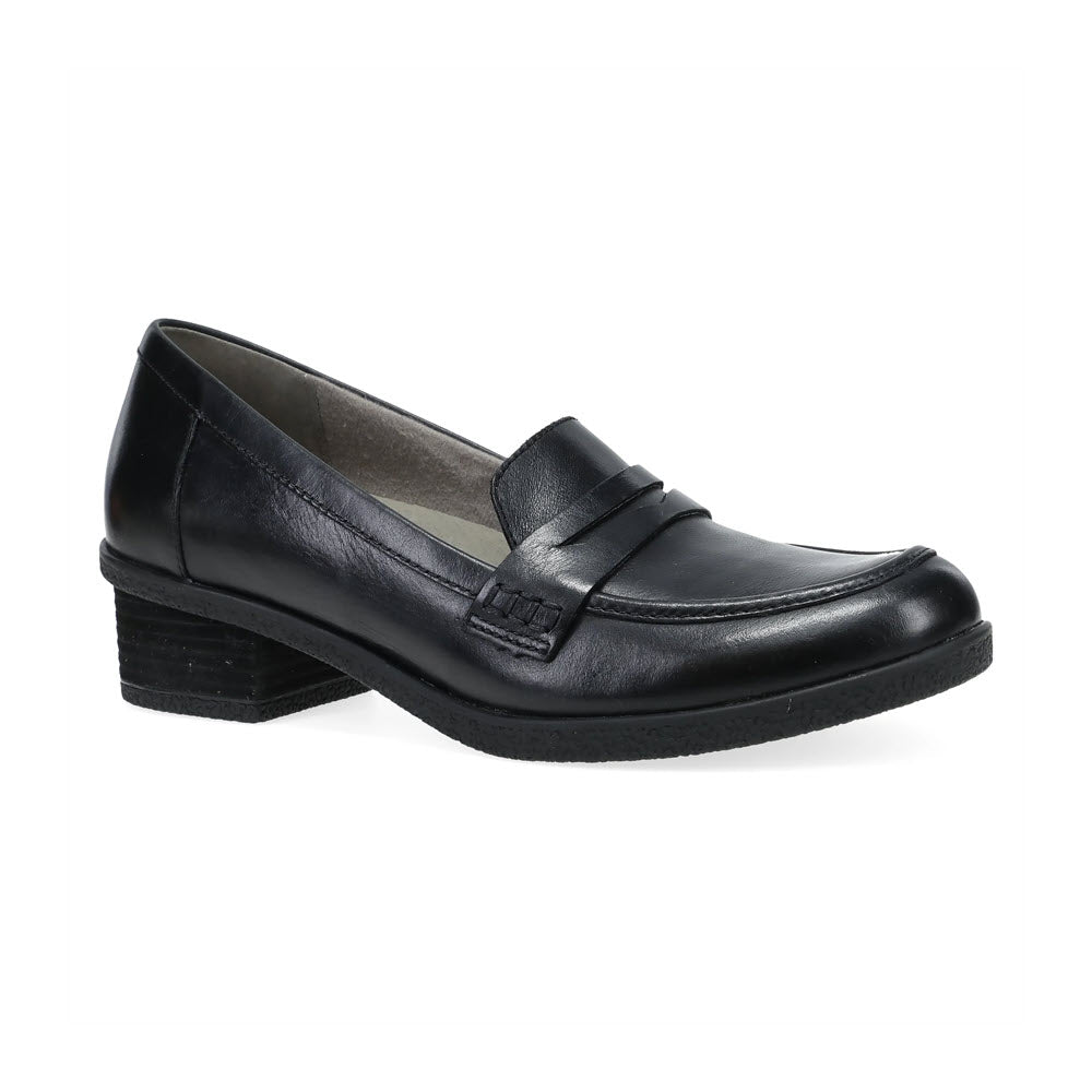 The Dansko Danica Black - Women&#39;s is a black leather loafer with a subtle heel, featuring a simple design and a strap over the instep, perfect for any occasion.