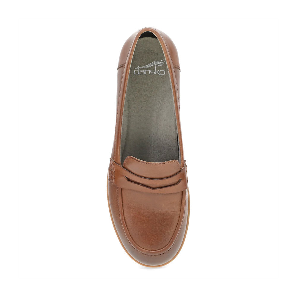 Top view of the DANSKO DANICA TAN - WOMENS, a brown leather chunky loafer by Dansko, with a penny strap detail, featuring a subtle heel and a gray insole adorned with the Dansko logo.