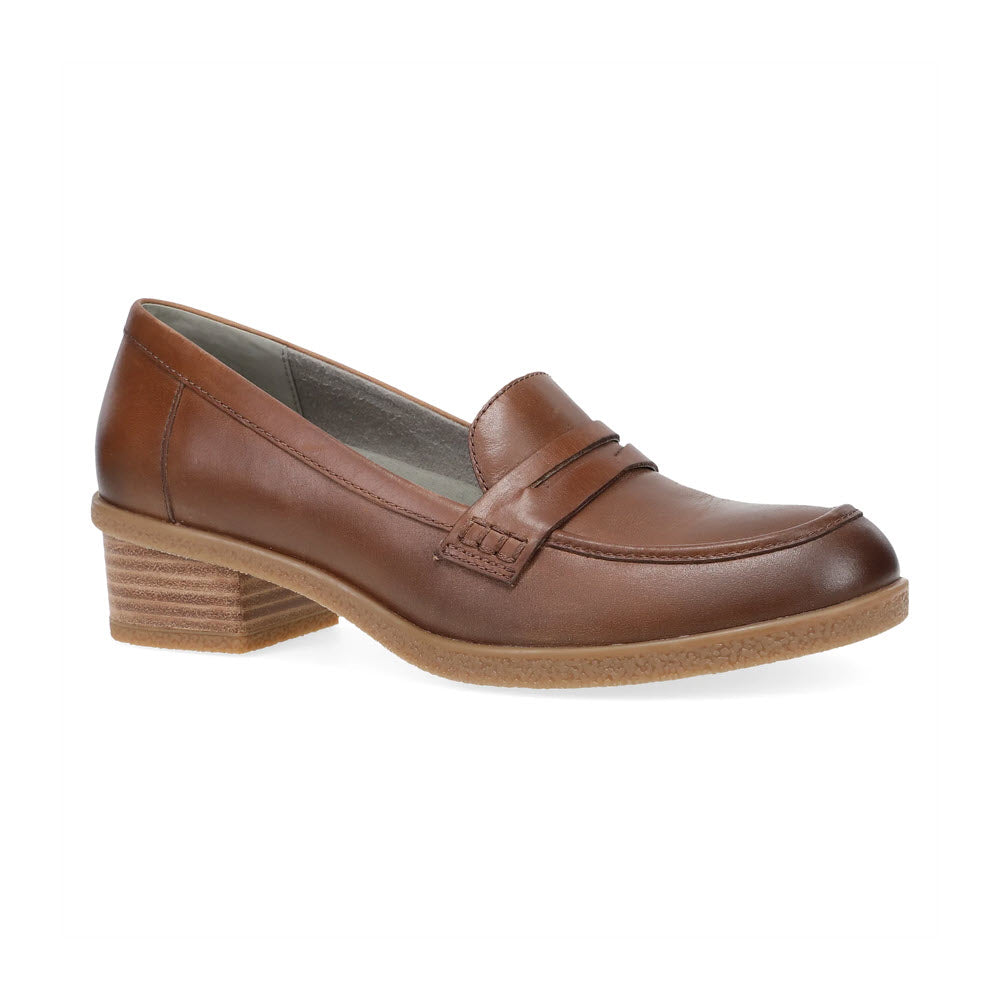 The Dansko Danica Tan - Women&#39;s loafer combines a subtle heel with a classic penny loafer design, featuring a low stacked heel and textured sole.