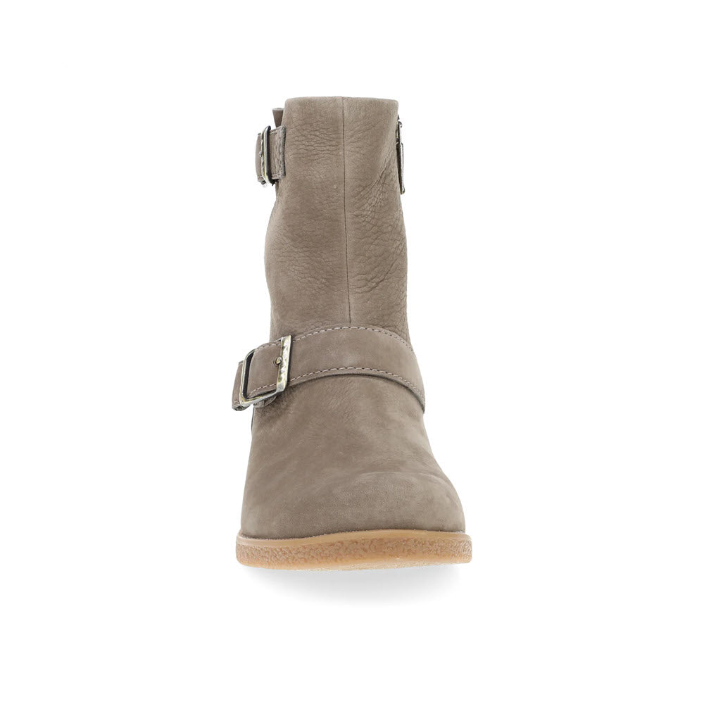 Front view of the Dansko Delphine Stone suede moto bootie in grey, showcasing stylish hardware with a side zipper and buckle straps, isolated on a white background.