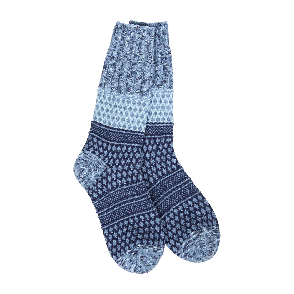 Experience ultimate comfort with the Worlds Softest Gallery Texture Crew Socks Peacoat for women. These cozy blue patterned socks showcase a stunning array of shades and intricate geometric designs, all set against a pristine white background. Ideal for sweater weather!