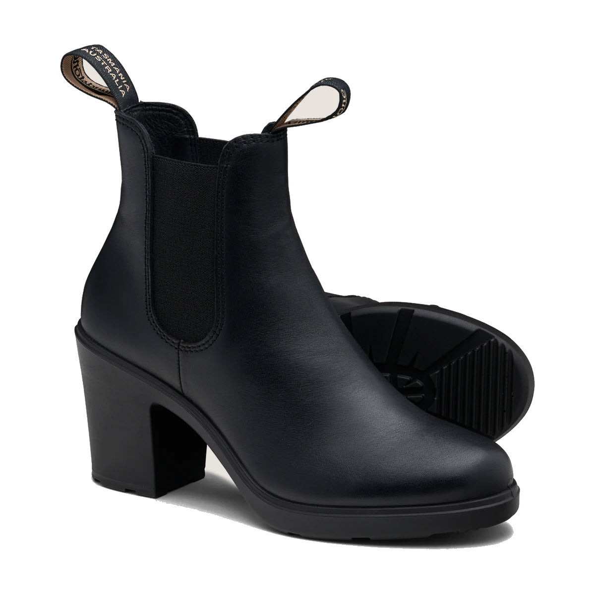 A pair of Blundstone BLUNDSTONE 2365 BLOCK HEEL BLACK - WOMENS water-resistant leather ankle boots with 3&quot; block heels, elastic side panels, and pull tabs on the back of the openings, offering both comfort and durability.