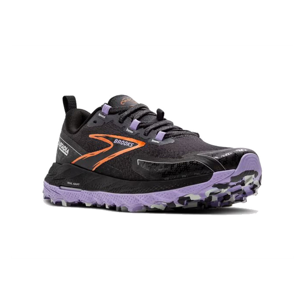 The BROOKS CASCADIA 18 EBONY/SWEET LAVENDER/COPPER - WOMEN&#39;S trail-running shoes by Brooks sport a black and purple design with orange accents. They feature a rugged sole designed for off-road terrain, sticky traction for enhanced grip, ample cushioning for comfort, and the signature Brooks logo along the side.