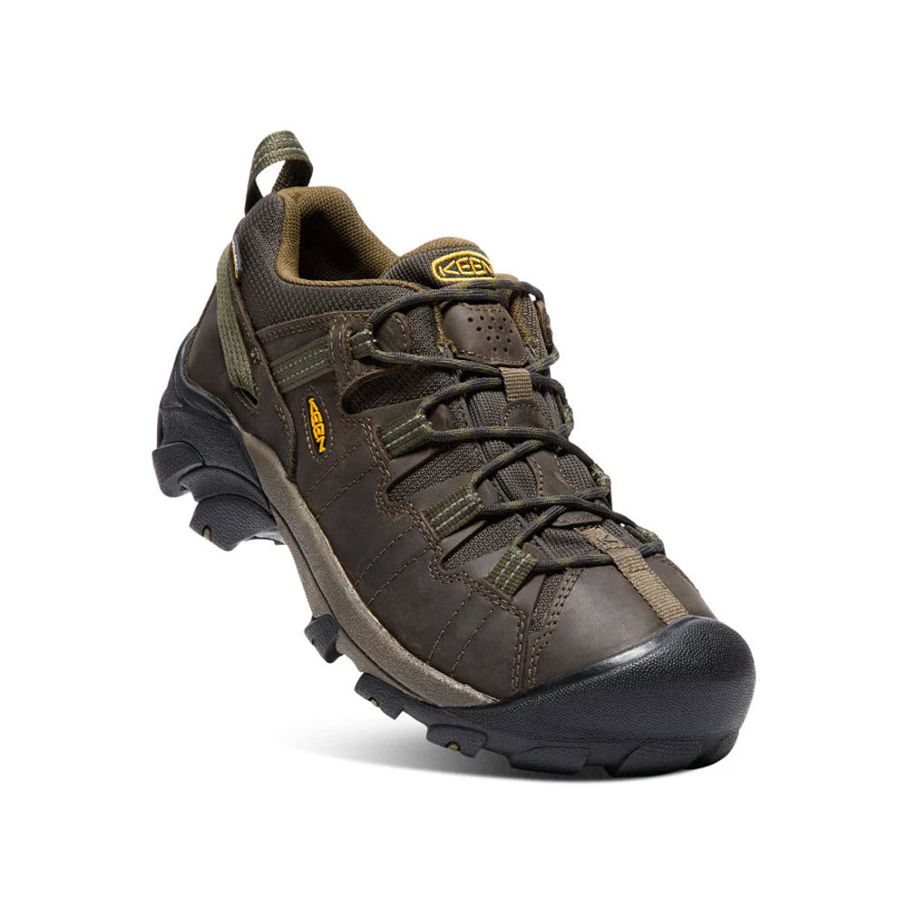 A men&#39;s KEEN Targhee II Canteen/Dark Olive hiking shoe featuring black laces, a durable tread for excellent traction, a waterproof barrier, and yellow KEEN branding on the tongue and side.