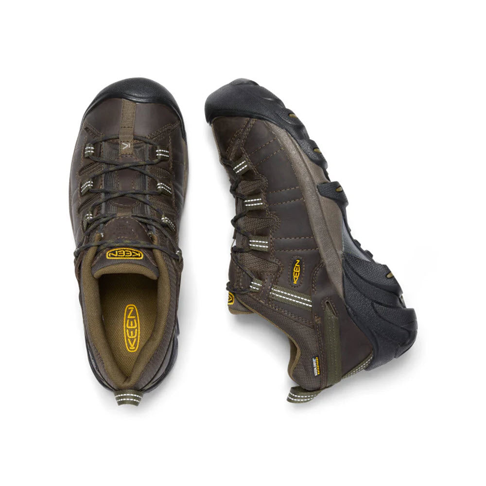 A pair of dark brown and dark olive KEEN Targhee II hiking shoes for men, featuring black soles with an aggressive outsole for superior traction, shown from different angles on a white background.