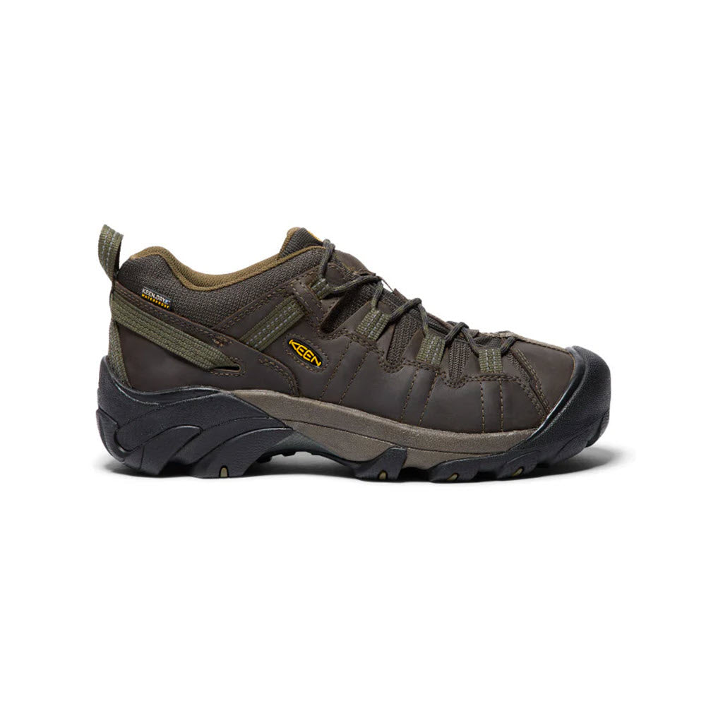 A single KEEN Targhee II Canteen/Dark Olive men&#39;s hiking shoe featuring a brown color with black accents, an aggressive outsole, a thick rugged sole, and a small yellow Keen logo on the side.