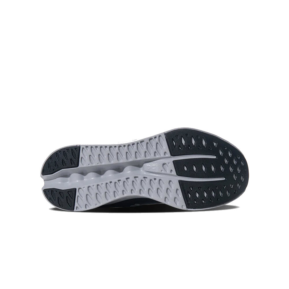 Bottom view of a black and white On Running Cloudsurfer Iron/Glacier women&#39;s athletic sneaker sole with a textured, patterned design for traction and CloudTec cushioning.