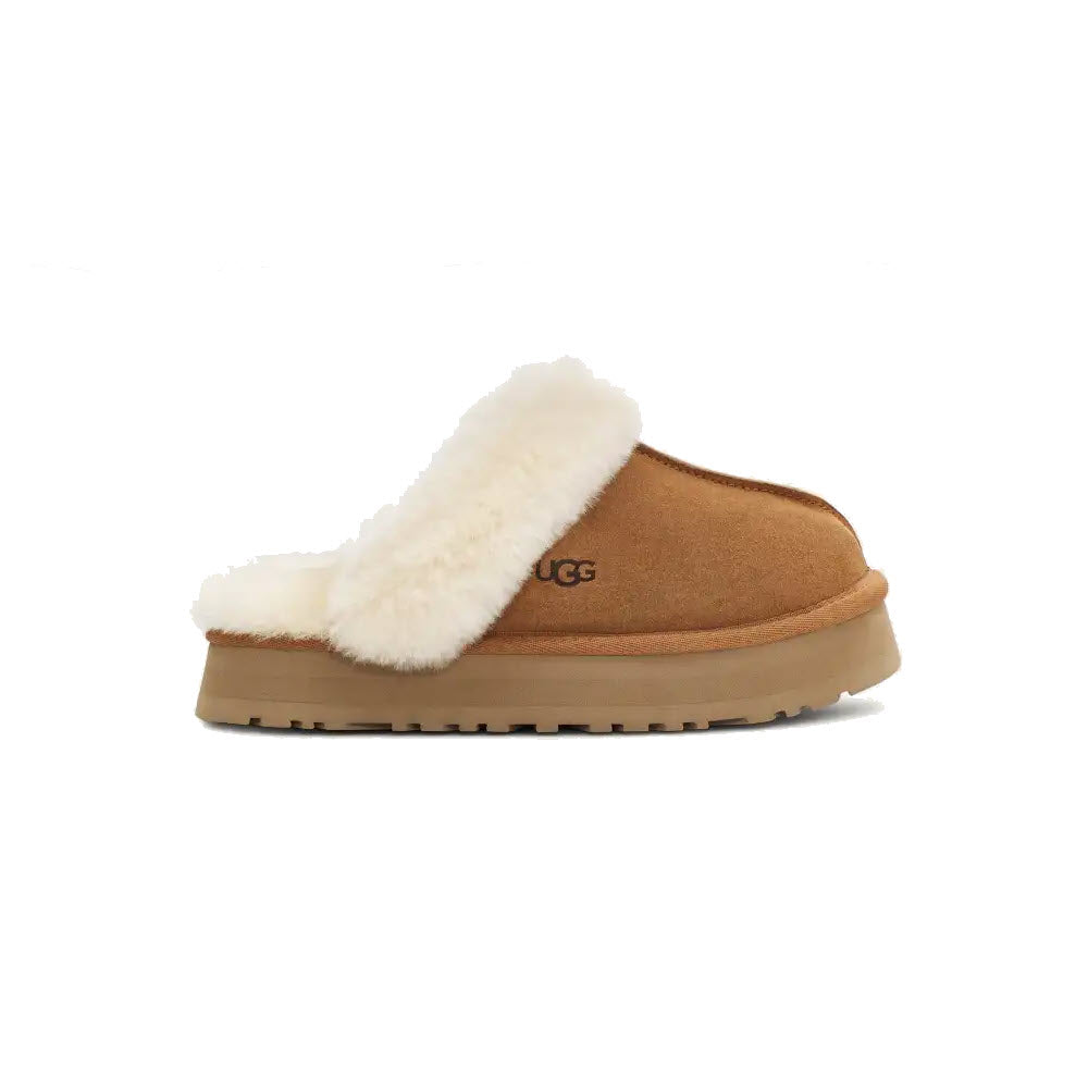 A chestnut slip-on clog with a retro-style platform sole, tan base, and white fur lining, branded &quot;Ugg&quot; on the side, called the UGG Disquette in women&#39;s sizing.