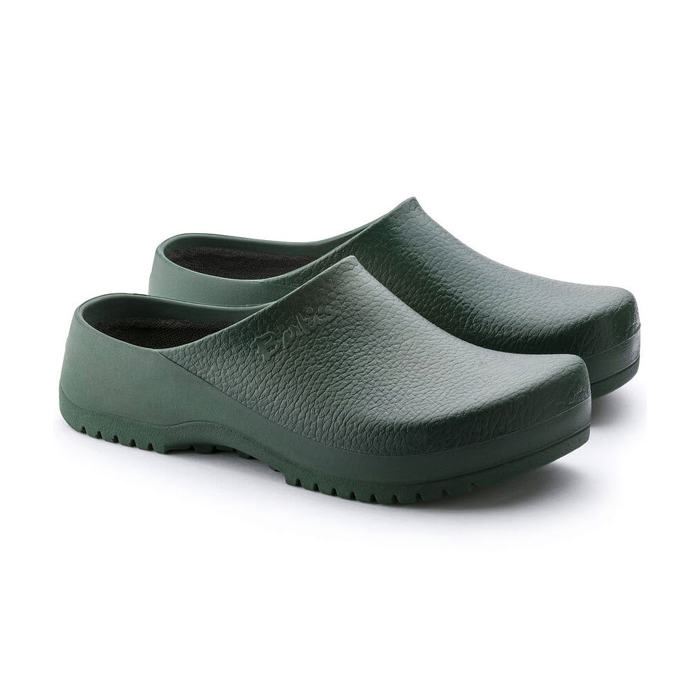 A pair of Birkenstock BIRKENSTOCK SUPER BIRKI GREEN - WOMENS with a textured upper, ridged sole, and fluid-resistant PU for anatomic support.