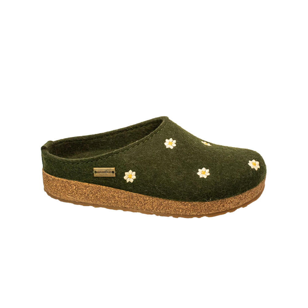 The HAFLINGER MARGHERITA GREEN - WOMENS from Haflingers is a cozy clog made from green wool felt, complemented by a cork sole and embellished with small white flowers.