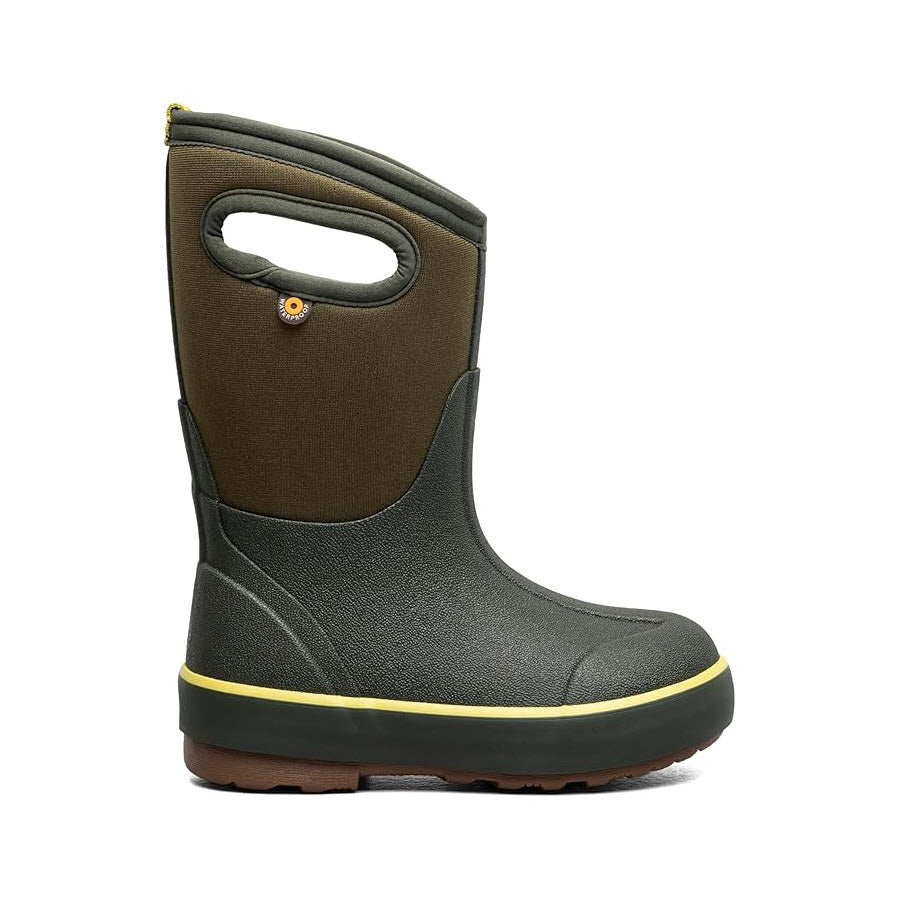 The Bogs Kids&#39; Classic II Solid Dark Green boot is crafted from neoprene and rubber, featuring a brown sole and yellow trim. This mid-calf boot includes a handle cutout at the top for easy carrying and is designed to offer better traction for natural foot movement.