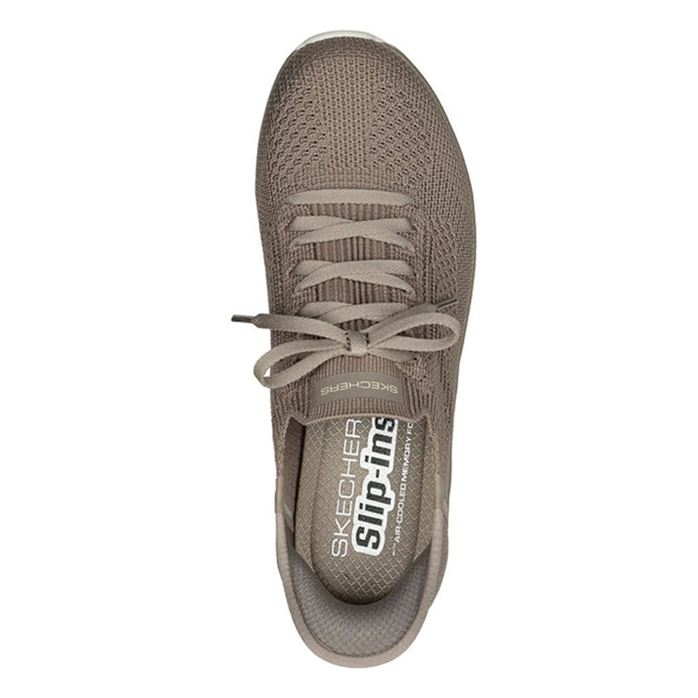 Top view of a single brown SKECHERS SLIP-INS VIRTUE DIVINITY TAUPE - WOMENS shoe with knit fabric and a lace-up design. Featuring Stretch Fit technology, the insole is labeled &quot;Skechers Hands Free Slip-ins&quot; and includes Air-Cooled Memory Foam for added comfort.