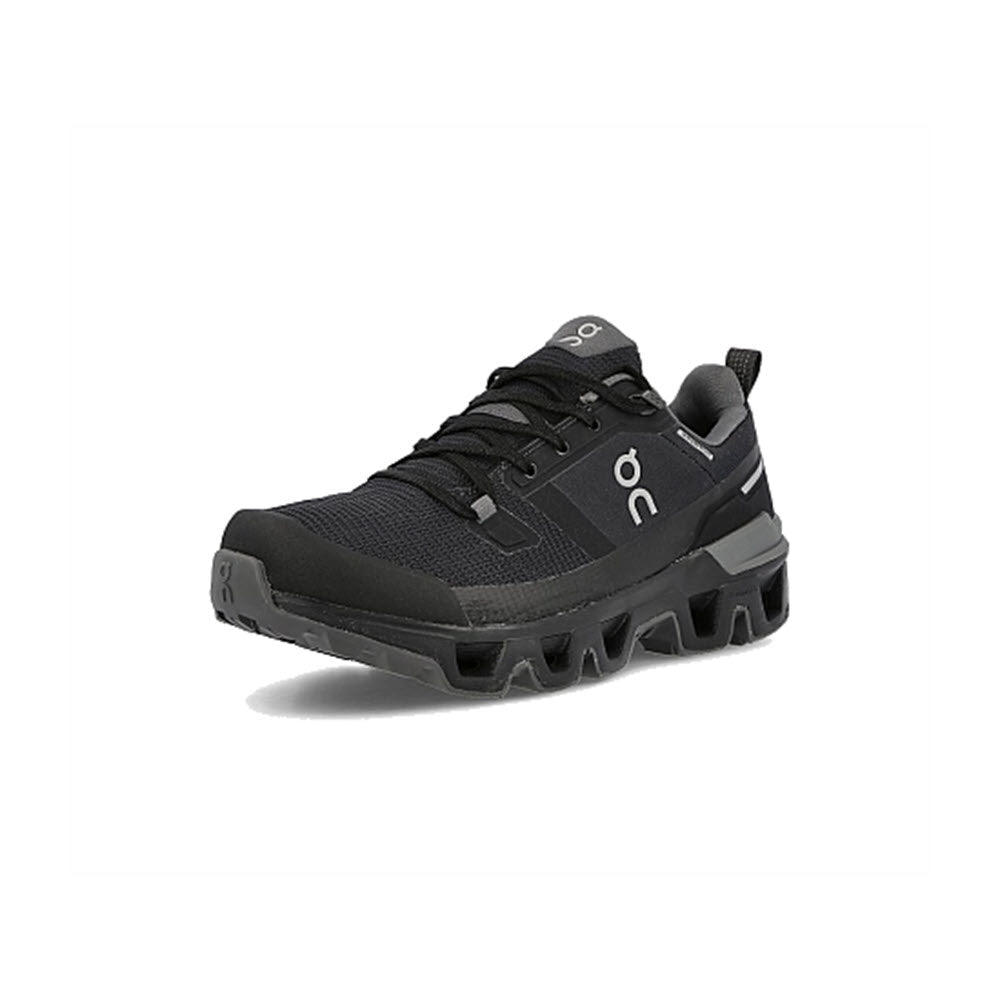 The ON CLOUDWANDER WATERPROOF BLACK/ECLIPSE - WOMENS from On Running showcases a single black athletic shoe accented with a white logo on the side. Featuring a rugged sole and lace-up design, this outdoor performance shoe is set against a plain white background. Lightweight and agile, it&#39;s crafted to conquer any terrain.