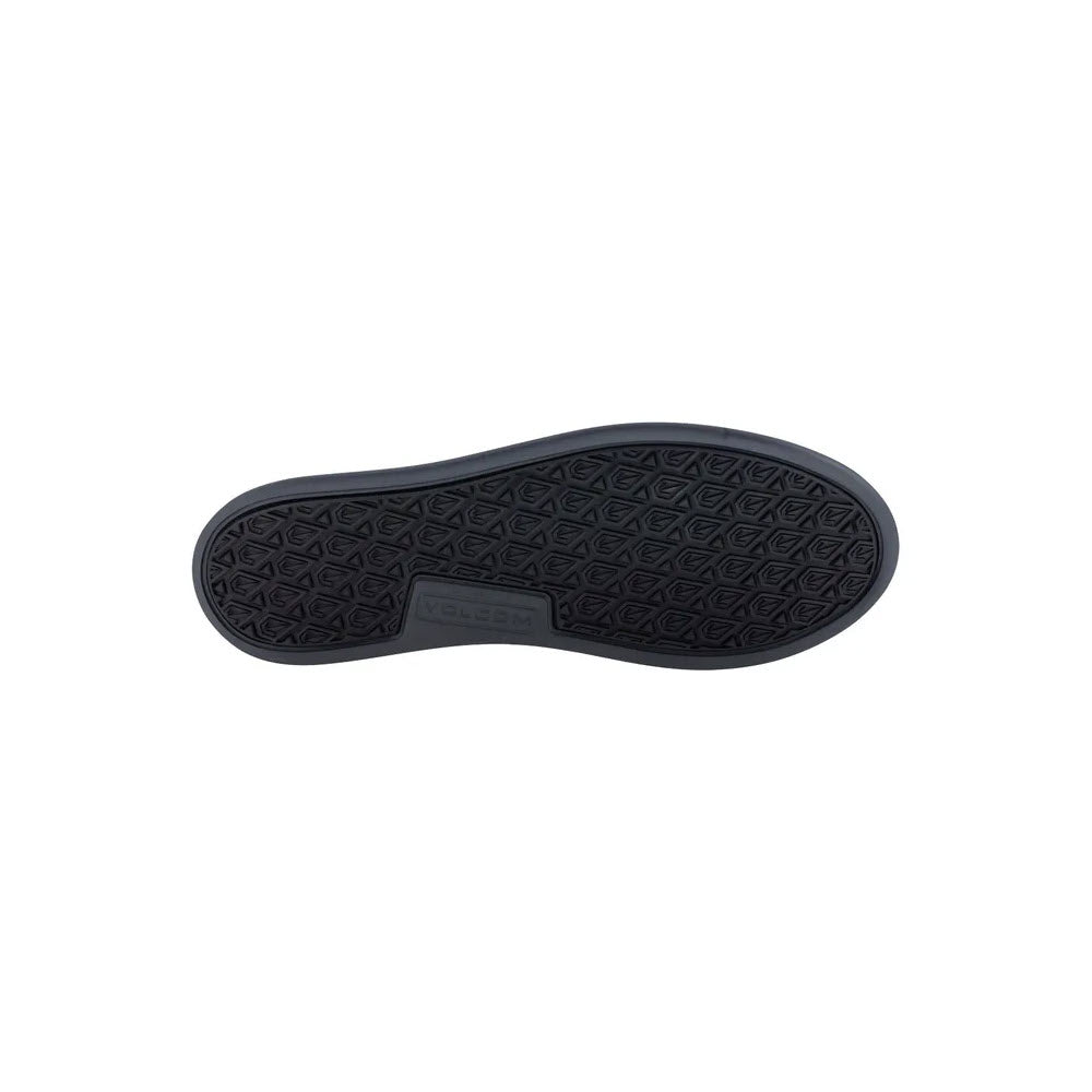 The image shows the sole of the VOLCOM COMPOSITE TOE CHILL SLIP ON ESD WORK SHOE BLACK - WOMENS by Volcom, showcasing its patterned tread design.