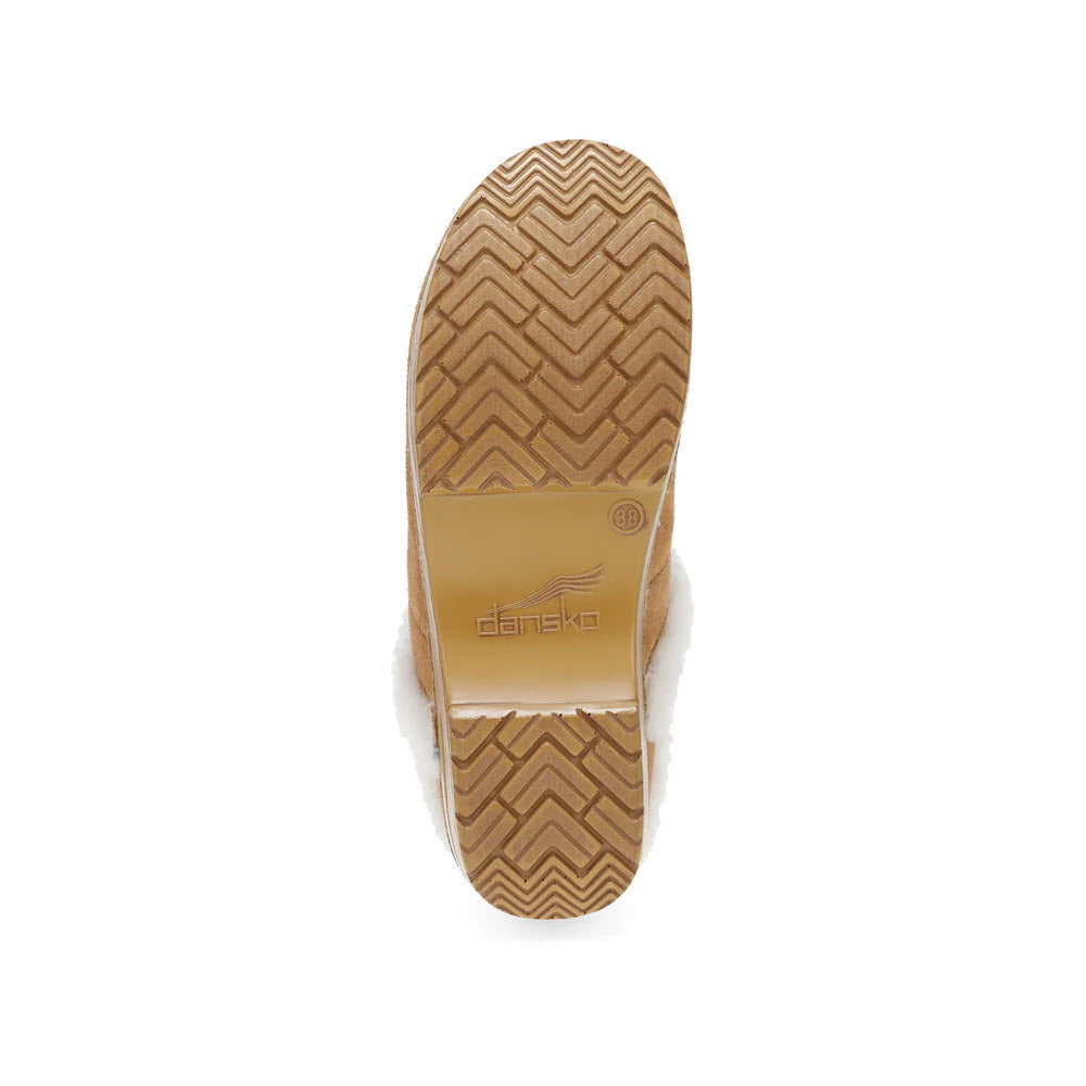 The Dansko Professional Cozy Suede for women boasts a sole with a zigzag pattern, prominently displaying the Dansko logo at its center. The sole&#39;s rubber texture is light brown, and it includes a contoured footbed for superior comfort.