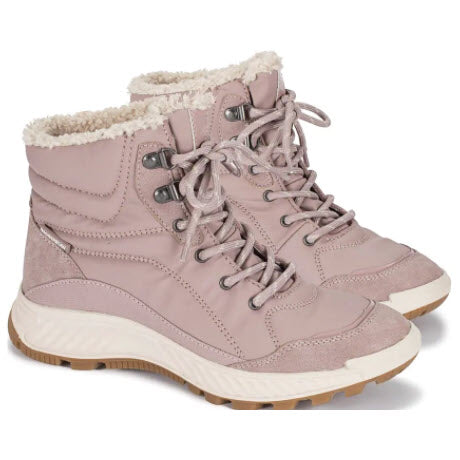 A pair of pink Baretraps Maine Midnight winter boots with white faux fur lining and rubber soles.