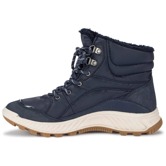 A navy blue Baretraps Maine Midnight winter boot with a cream sole, isolated on a white background.